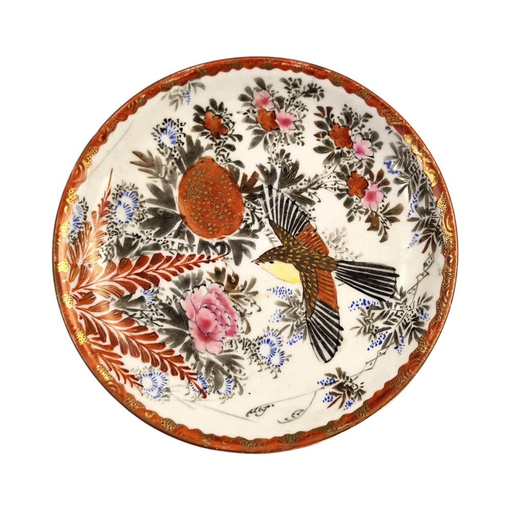 A Japanese Kutani porcelain teapot decorated with iron-red enamel, gilded accents, and hand-painted figurative scenes, seated on a matching pedestal stand. View III