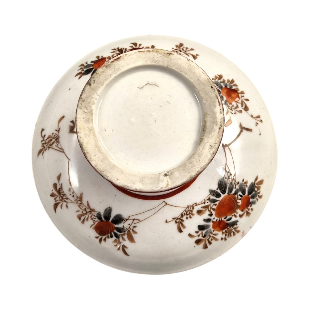 A Japanese Kutani porcelain teapot decorated with iron-red enamel, gilded accents, and hand-painted figurative scenes, seated on a matching pedestal stand. View IV