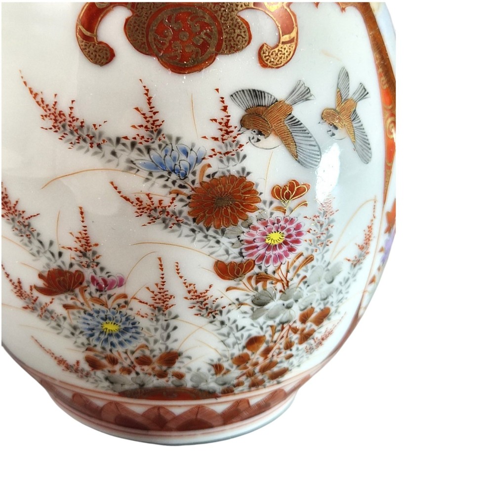 A Japanese Kutani porcelain teapot decorated with iron-red enamel, gilded accents, and hand-painted figurative scenes, seated on a matching pedestal stand. View XII