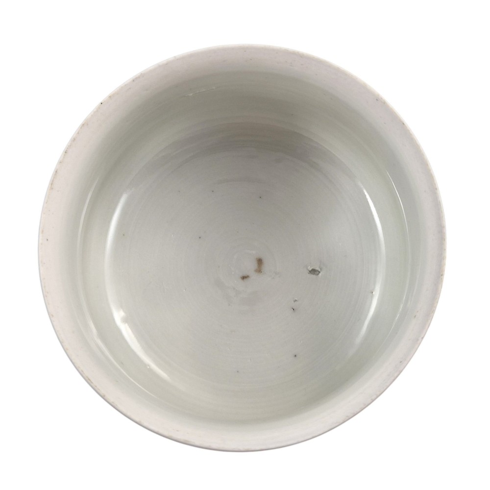 A pair of late 19th-century white Japanese Imari porcelain handleless sencha teacups hand-painted with figures at low desks and floral motifs in iron red and black enamels. View VIII