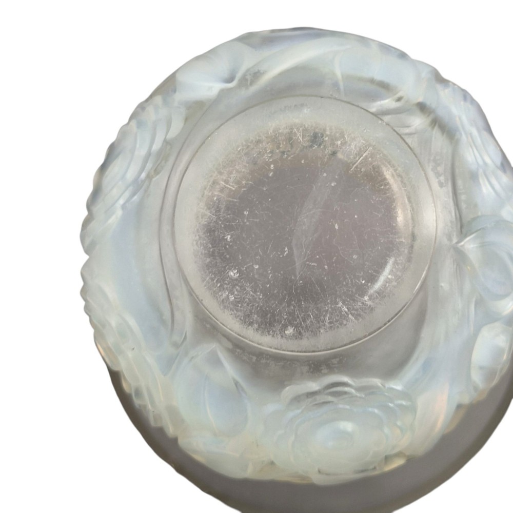 A French opalescent glass vase featuring a flared frosted neck and a rounded base carved with raised ranunculus floral motifs. View VII