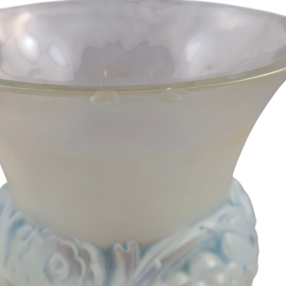 A French opalescent glass vase featuring a flared frosted neck and a rounded base carved with raised ranunculus floral motifs. View IX