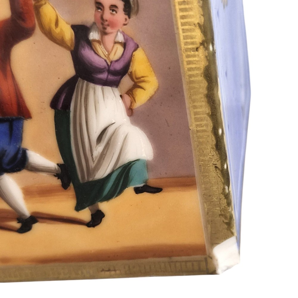 A pair of square 19th-century French porcelain perfume bottles featuring cobalt blue tops, gilded necks, and hand-painted genre scenes of figures in tavern settings. View XIV