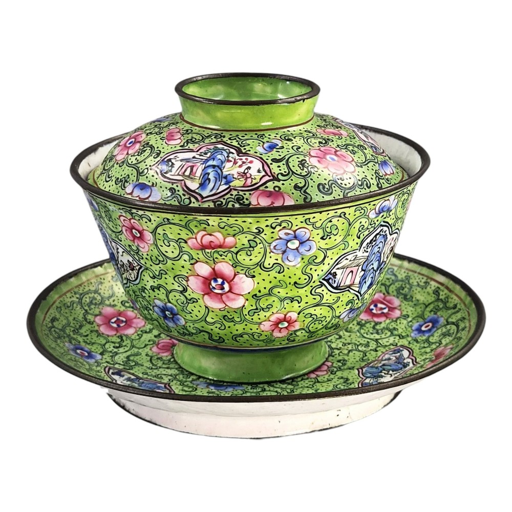 A Chinese Canton enamel gaiwan featuring a green ground with pink floral scrolls and landscape cartouches, complete with lid and matching saucer. View III