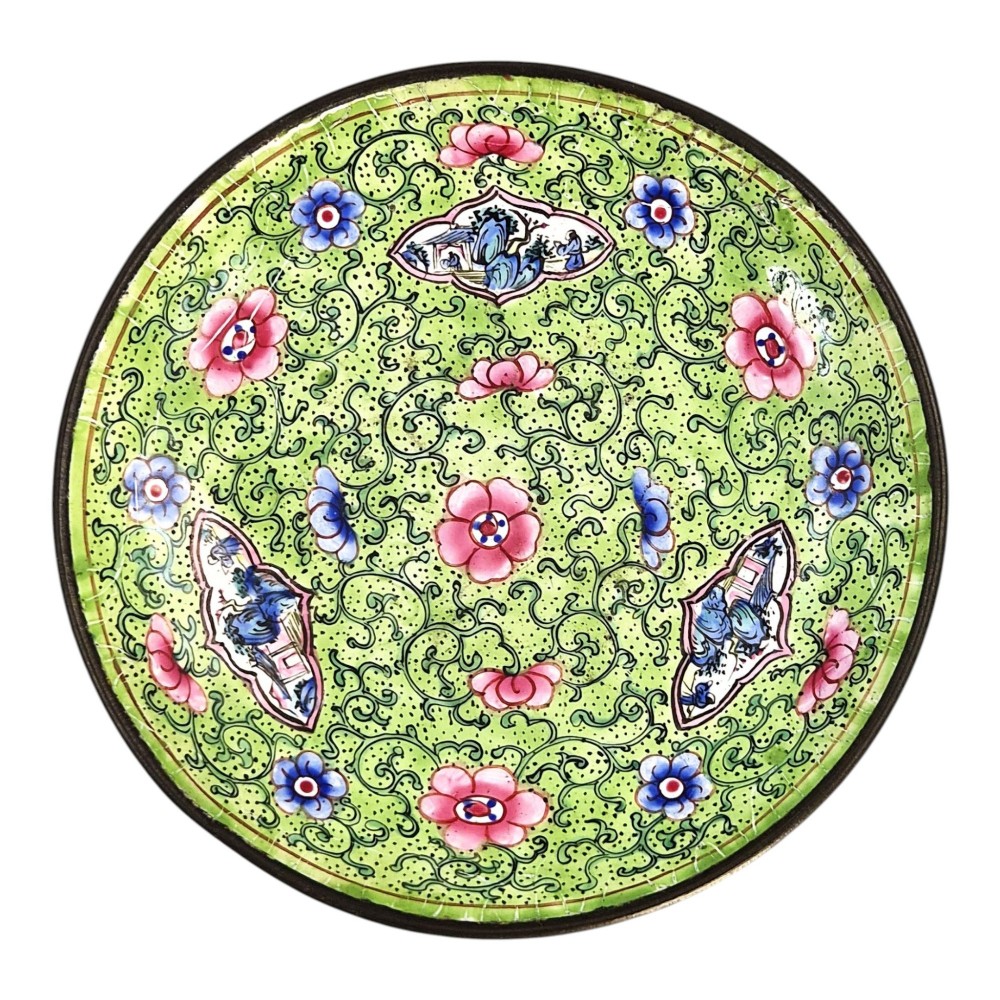A Chinese Canton enamel gaiwan featuring a green ground with pink floral scrolls and landscape cartouches, complete with lid and matching saucer. View VII