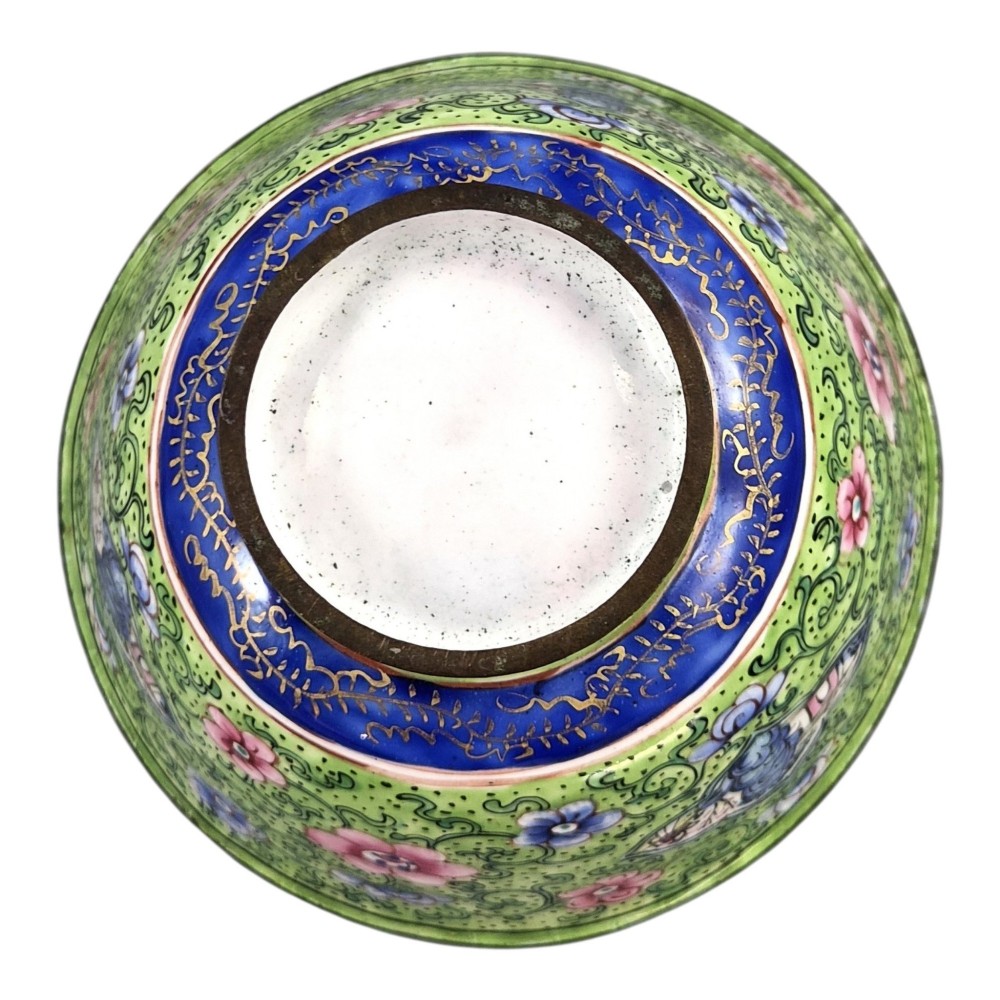 A Chinese Canton enamel gaiwan featuring a green ground with pink floral scrolls and landscape cartouches, complete with lid and matching saucer. View XI