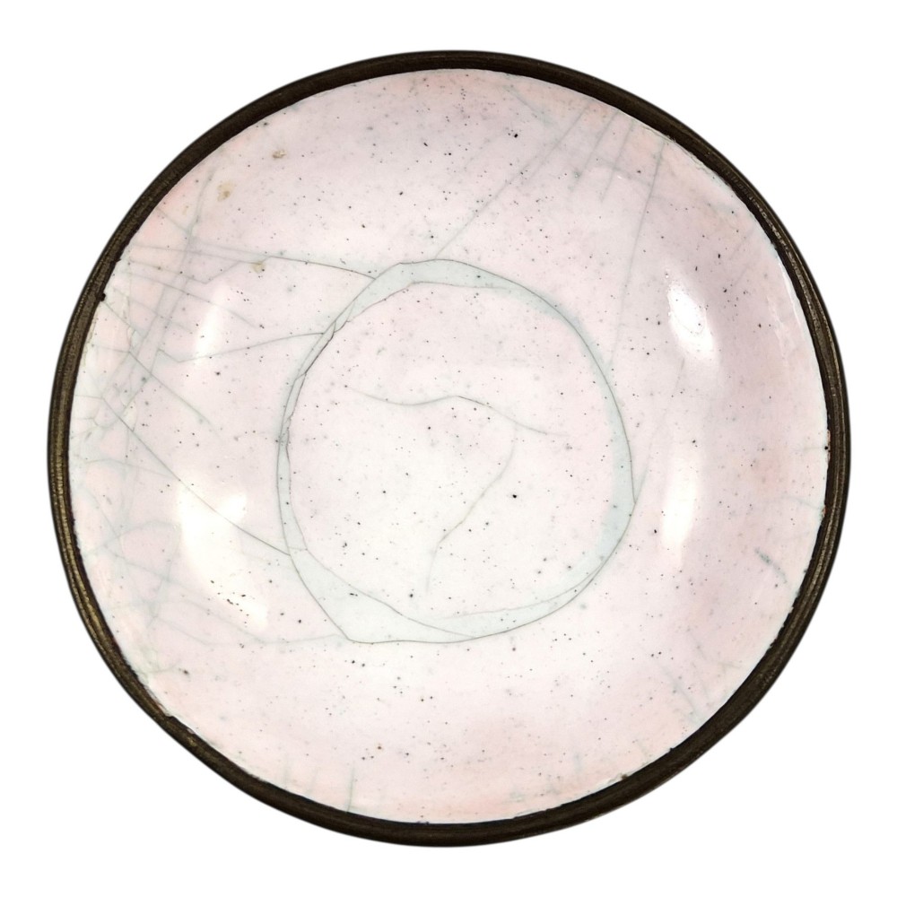 A Chinese Canton enamel gaiwan featuring a green ground with pink floral scrolls and landscape cartouches, complete with lid and matching saucer. View XII