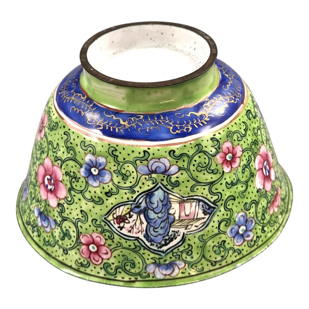 A Chinese Canton enamel gaiwan featuring a green ground with pink floral scrolls and landscape cartouches, complete with lid and matching saucer. View XIII
