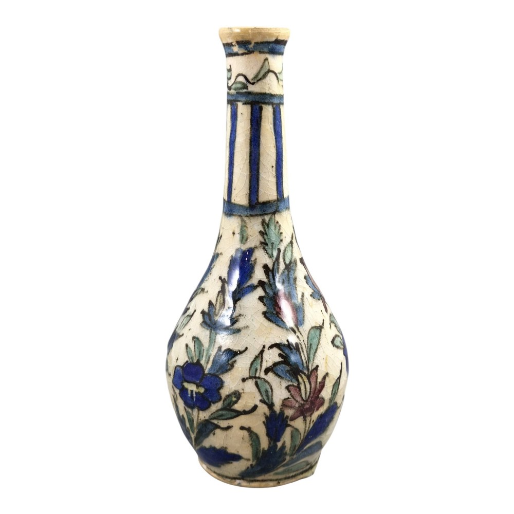 An Iranian Qajar ceramic bottle vase featuring an elongated neck, cream crackle glaze, and hand-painted blue and purple figurative portrait and floral motifs. View III