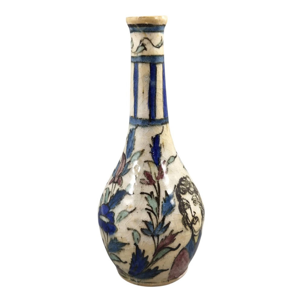 An Iranian Qajar ceramic bottle vase featuring an elongated neck, cream crackle glaze, and hand-painted blue and purple figurative portrait and floral motifs. View V