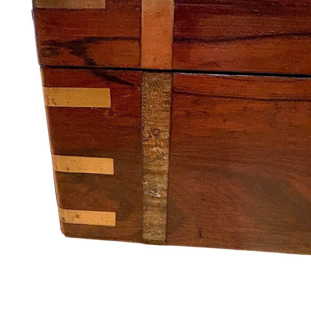 An open Victorian mahogany writing slope featuring flush brass corner bindings, internal pen compartments, and a green gilt-tooled leather writing surface. View XI