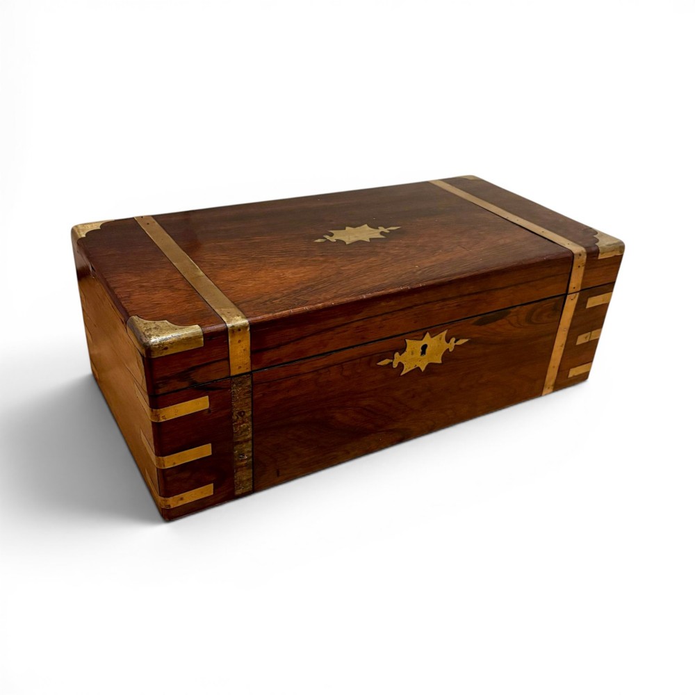 An open Victorian mahogany writing slope featuring flush brass corner bindings, internal pen compartments, and a green gilt-tooled leather writing surface. View XIII