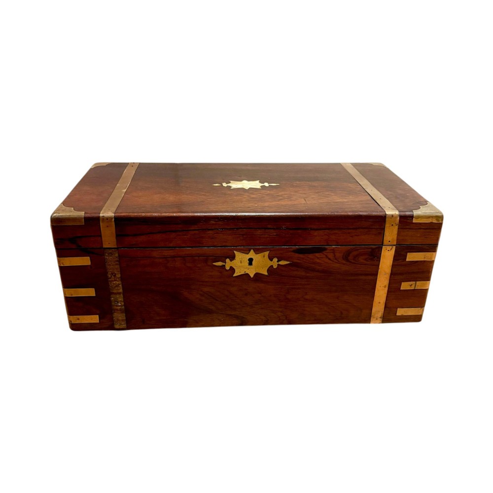 An open Victorian mahogany writing slope featuring flush brass corner bindings, internal pen compartments, and a green gilt-tooled leather writing surface. View XIV