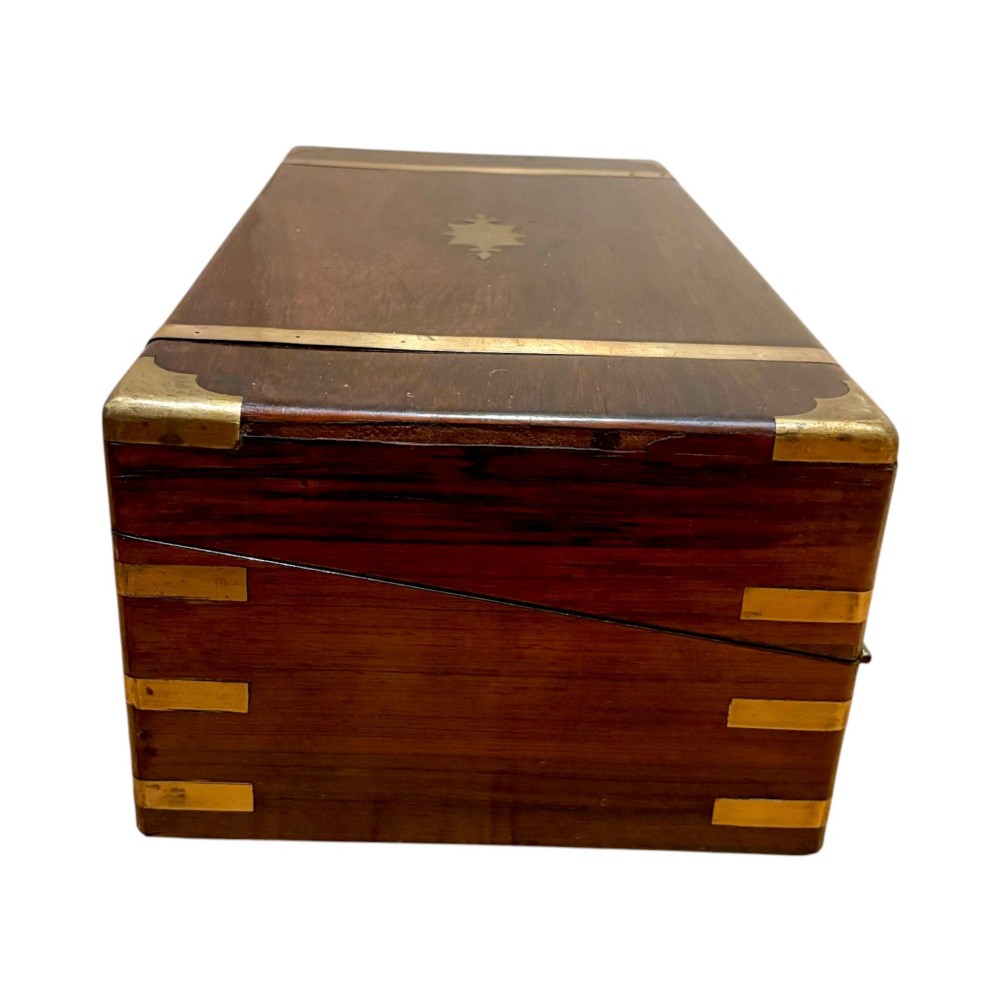 An open Victorian mahogany writing slope featuring flush brass corner bindings, internal pen compartments, and a green gilt-tooled leather writing surface. View XV
