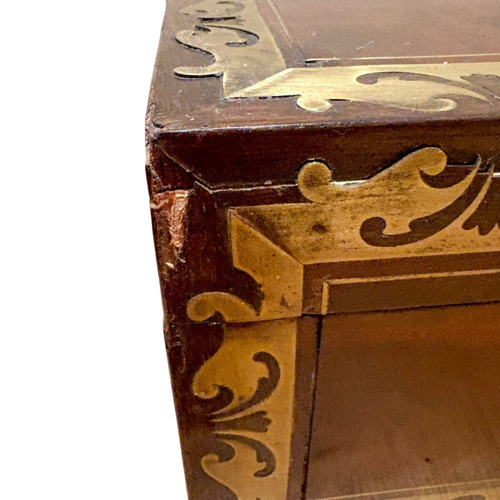 A rectangular dark mahogany writing slope featuring ornate brass scroll inlay around the borders and lid. View II