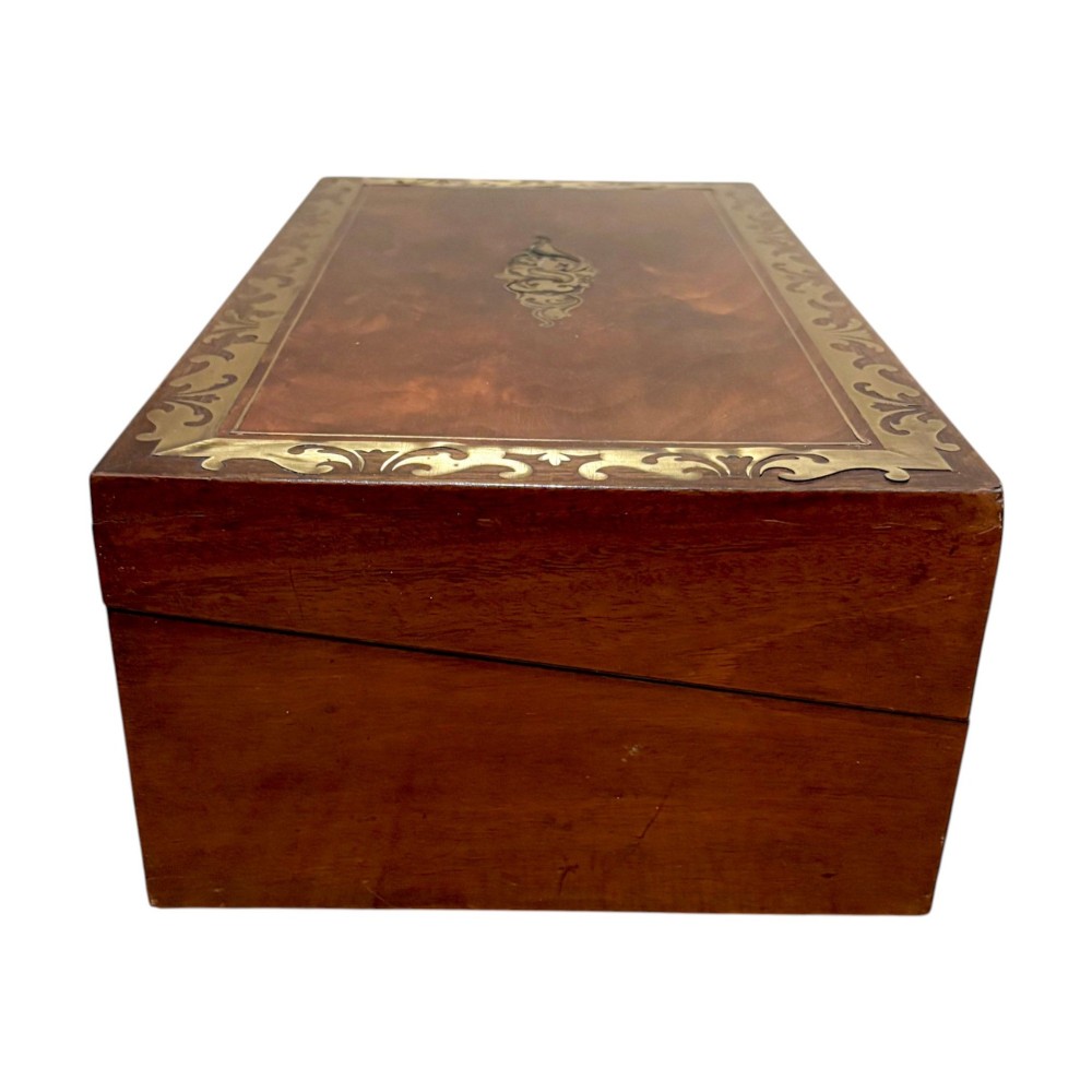 A rectangular dark mahogany writing slope featuring ornate brass scroll inlay around the borders and lid. View III