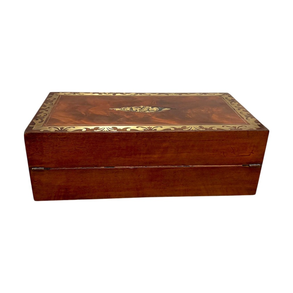A rectangular dark mahogany writing slope featuring ornate brass scroll inlay around the borders and lid. View IV