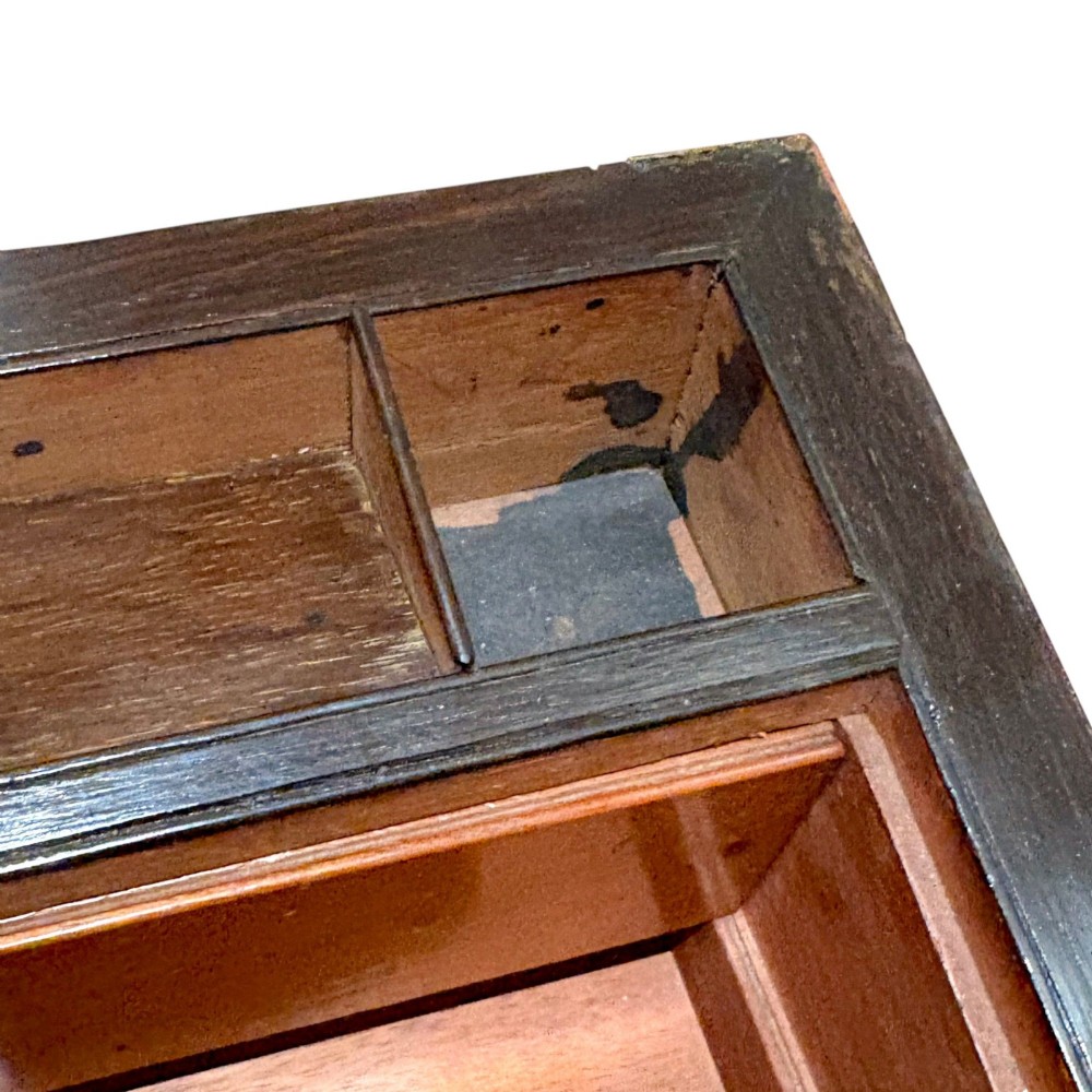 A rectangular dark mahogany writing slope featuring ornate brass scroll inlay around the borders and lid. View XI