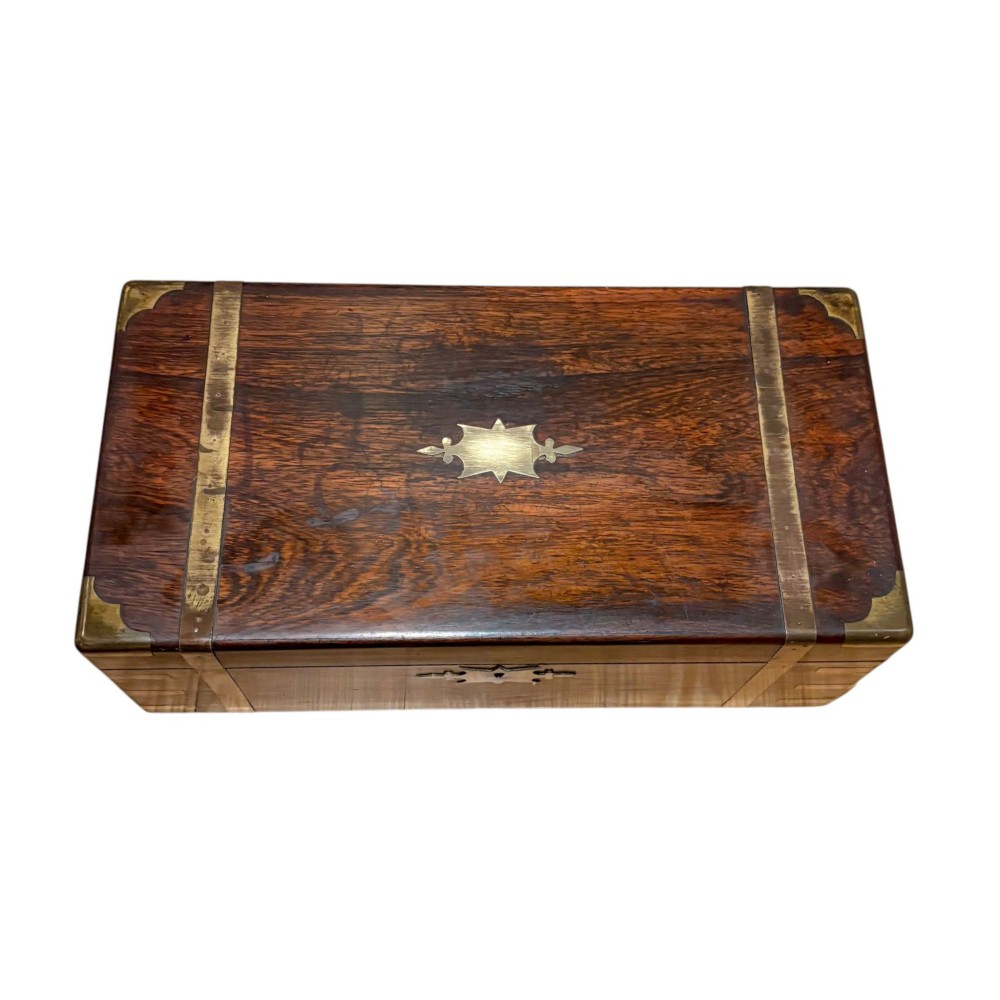 A closed rectangular Victorian rosewood writing slope featuring brass strapping, brass corner mounts, and a central brass escutcheon. View III