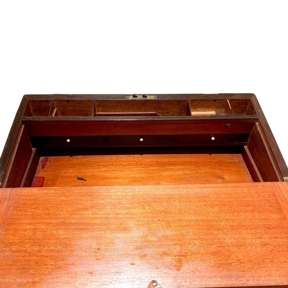 A closed rectangular Victorian rosewood writing slope featuring brass strapping, brass corner mounts, and a central brass escutcheon. View VII