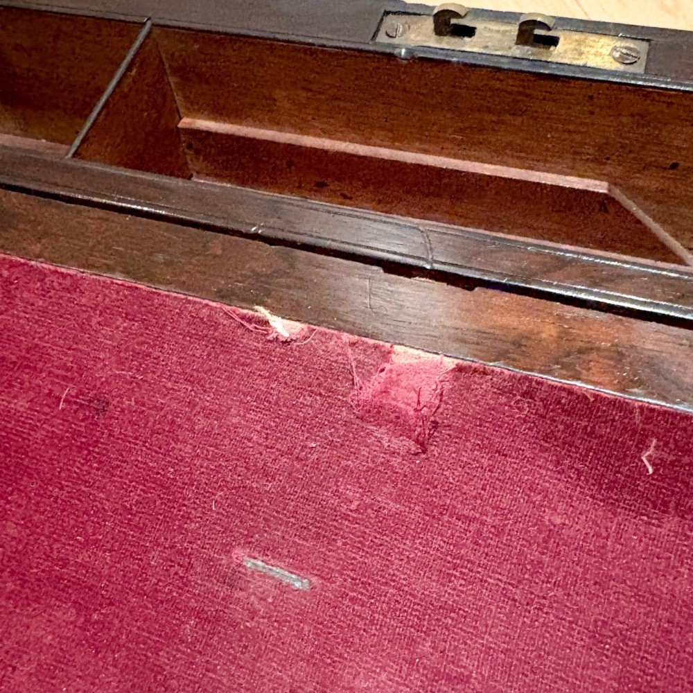 A closed rectangular Victorian rosewood writing slope featuring brass strapping, brass corner mounts, and a central brass escutcheon. View XI