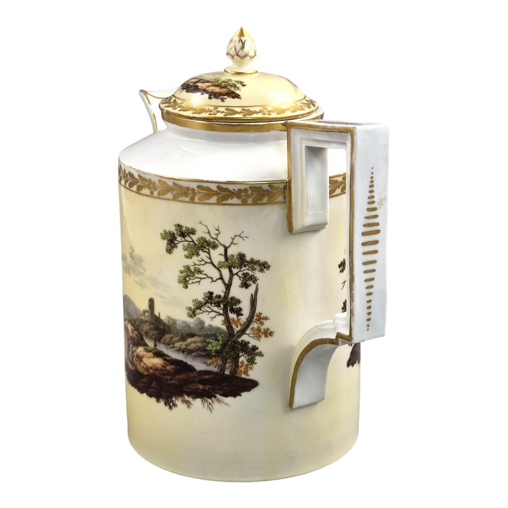 An 18th-century Furstenberg porcelain coffee pot featuring a hand-painted Neoclassical landscape, gold-leaf foliage rim, and an angular gilded handle with a pinecone finial lid. View II