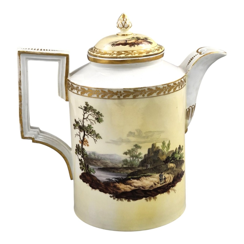 An 18th-century Furstenberg porcelain coffee pot featuring a hand-painted Neoclassical landscape, gold-leaf foliage rim, and an angular gilded handle with a pinecone finial lid. View IV
