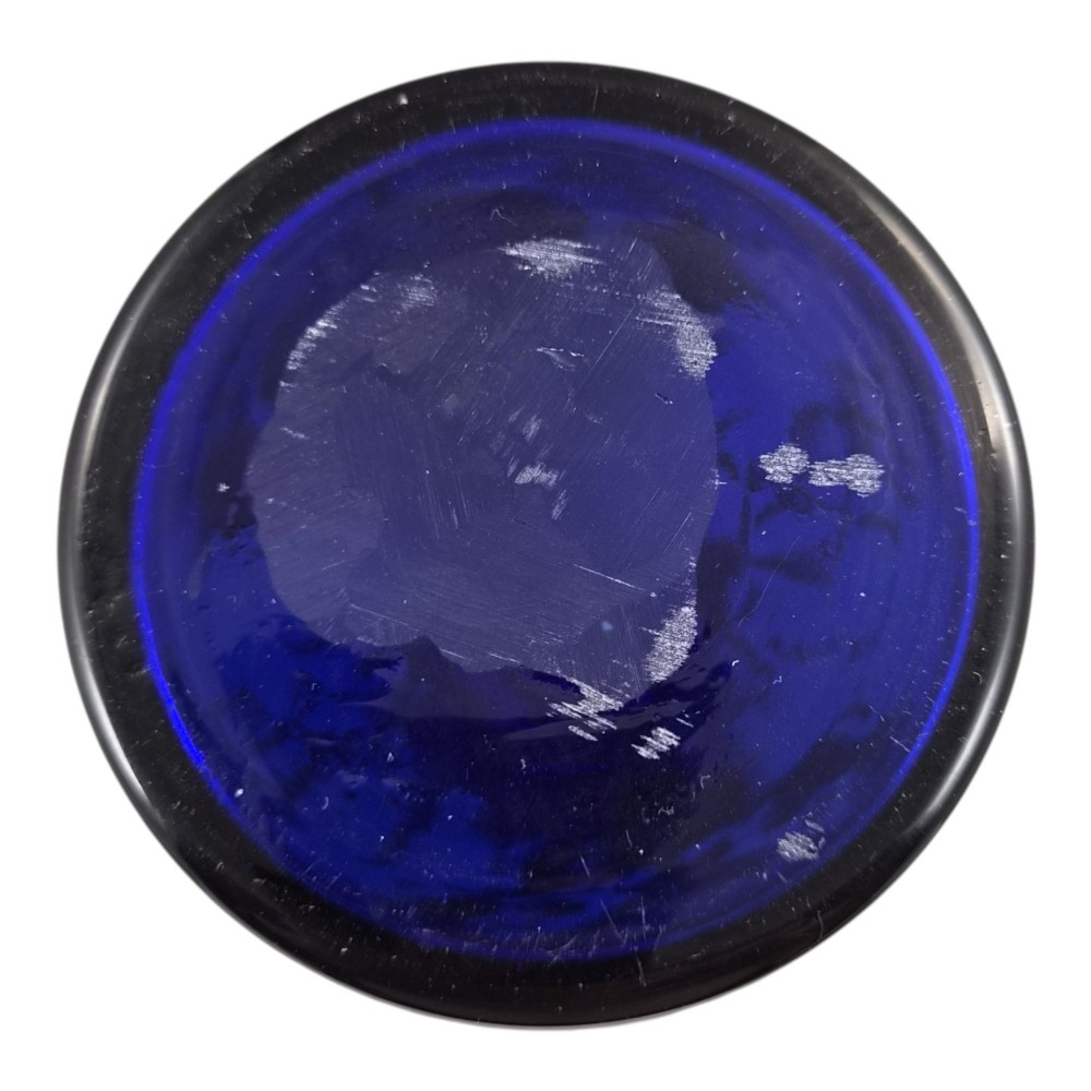 A cobalt blue Bohemian glass decanter decorated with elaborate gold enamelling and a painted portrait medallion, featuring a tall pointed stopper. View VII