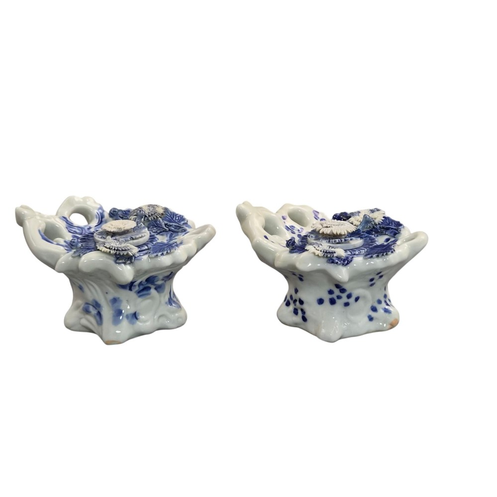 A pair of Japanese Hirado porcelain inkwells featuring fluted bases, underglaze blue decoration, and three-dimensional chrysanthemum motifs on the lids. View III