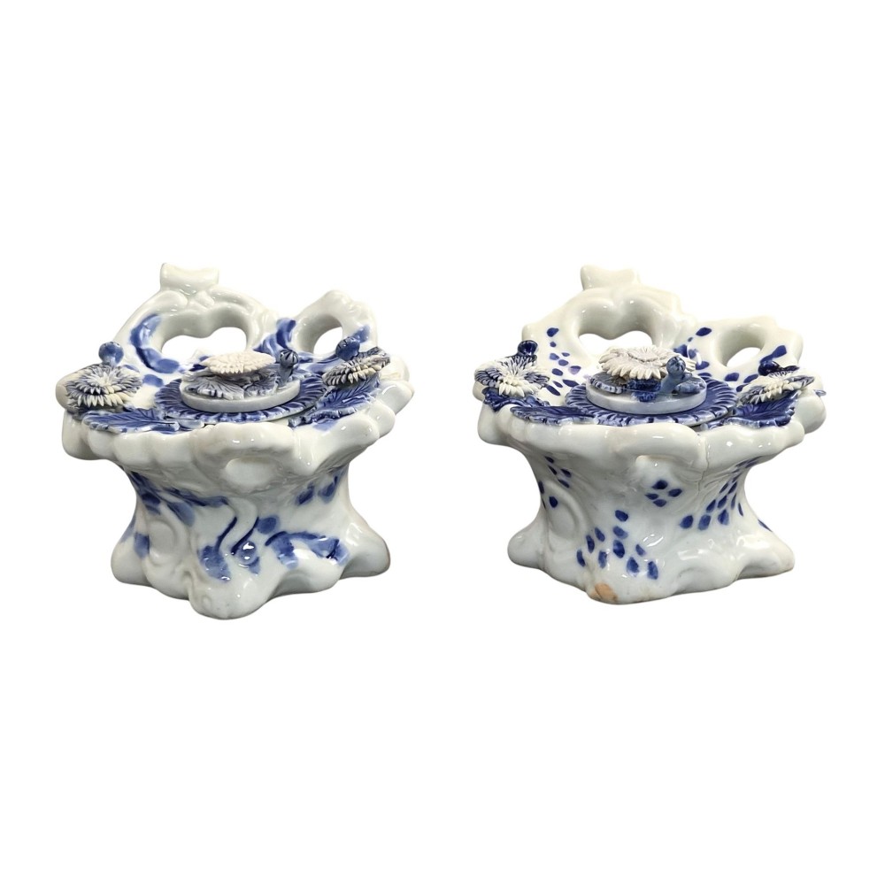 A pair of Japanese Hirado porcelain inkwells featuring fluted bases, underglaze blue decoration, and three-dimensional chrysanthemum motifs on the lids. View IV