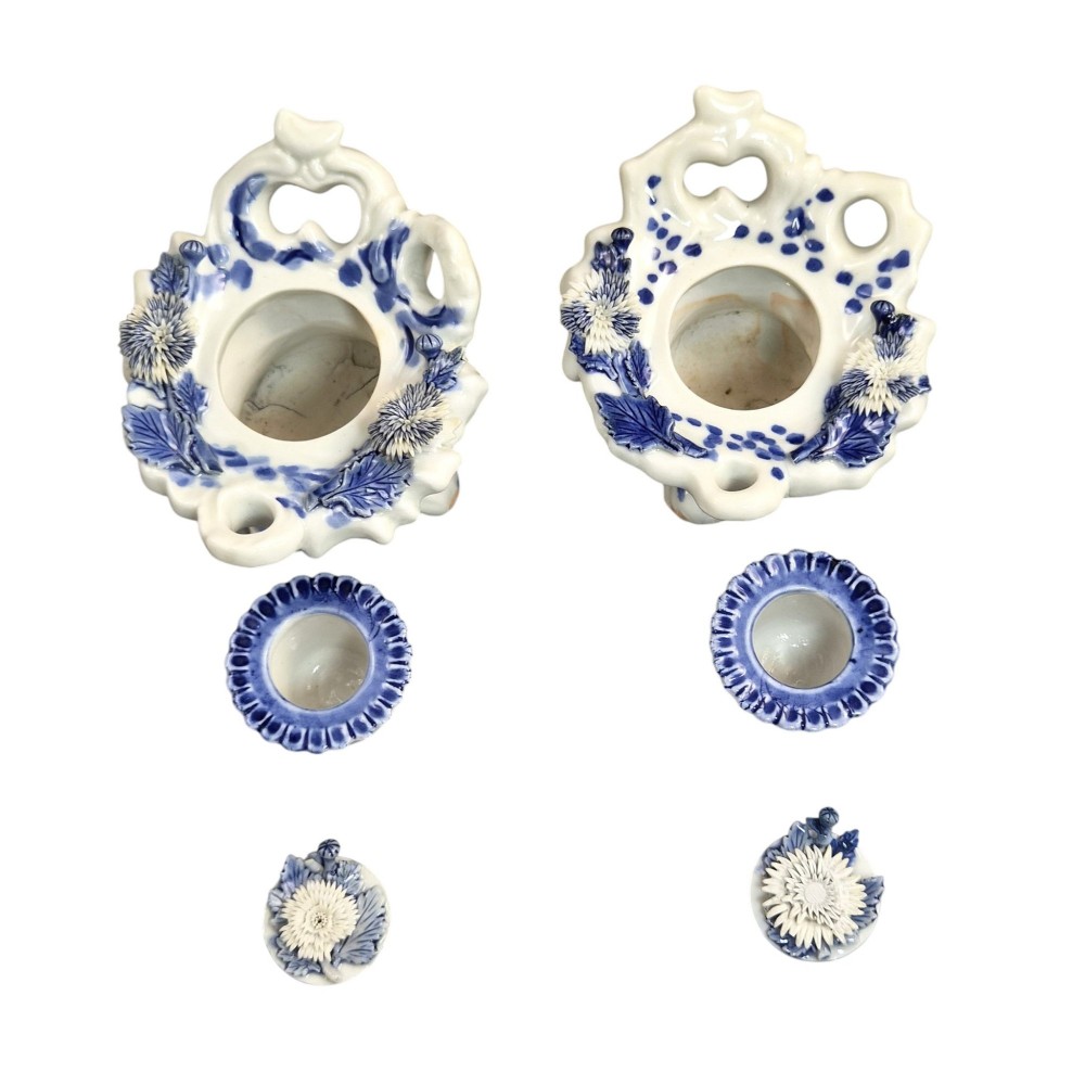 A pair of Japanese Hirado porcelain inkwells featuring fluted bases, underglaze blue decoration, and three-dimensional chrysanthemum motifs on the lids. View IX