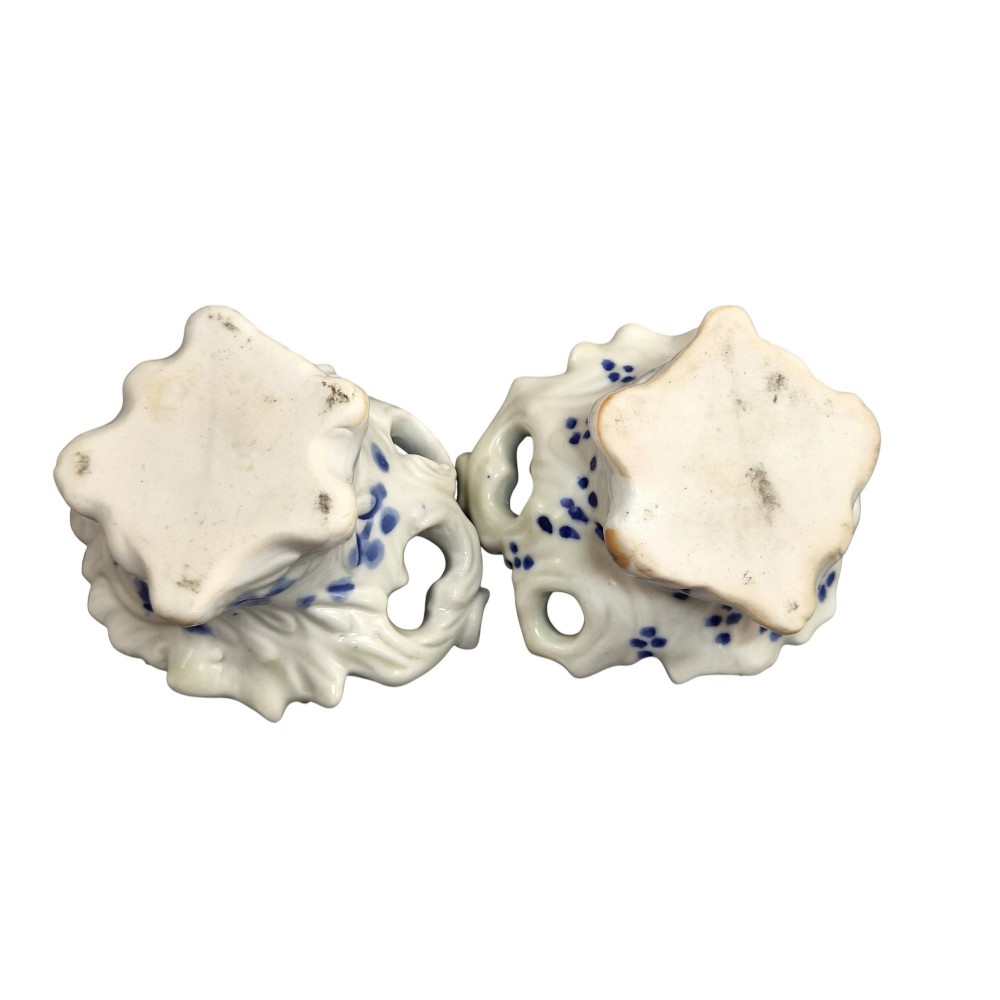 A pair of Japanese Hirado porcelain inkwells featuring fluted bases, underglaze blue decoration, and three-dimensional chrysanthemum motifs on the lids. View X