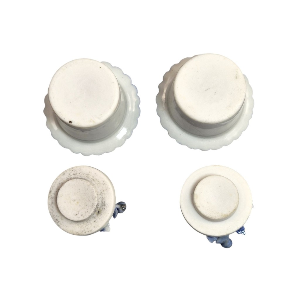 A pair of Japanese Hirado porcelain inkwells featuring fluted bases, underglaze blue decoration, and three-dimensional chrysanthemum motifs on the lids. View XI