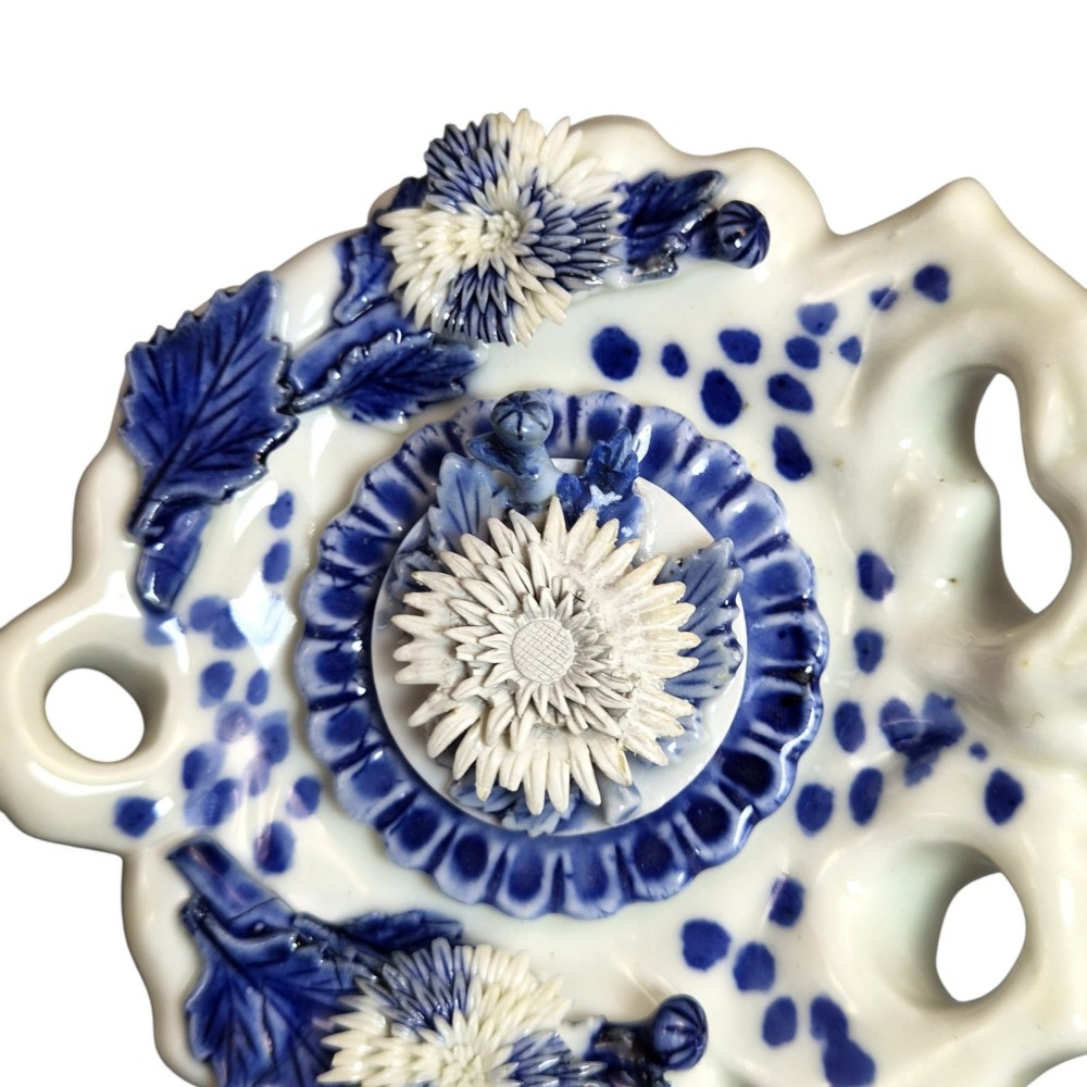 A pair of Japanese Hirado porcelain inkwells featuring fluted bases, underglaze blue decoration, and three-dimensional chrysanthemum motifs on the lids. View XIII