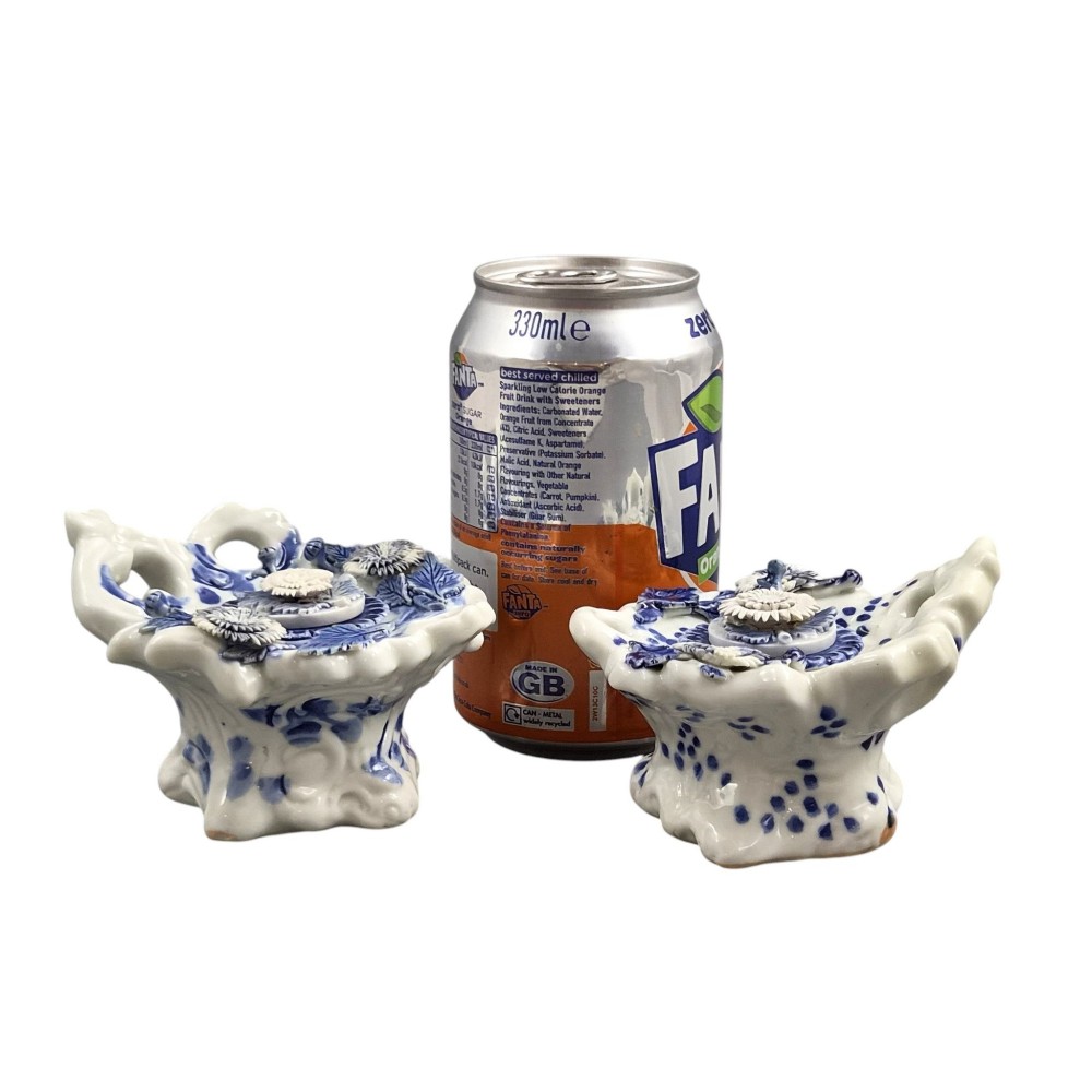 A pair of Japanese Hirado porcelain inkwells featuring fluted bases, underglaze blue decoration, and three-dimensional chrysanthemum motifs on the lids. View XIV