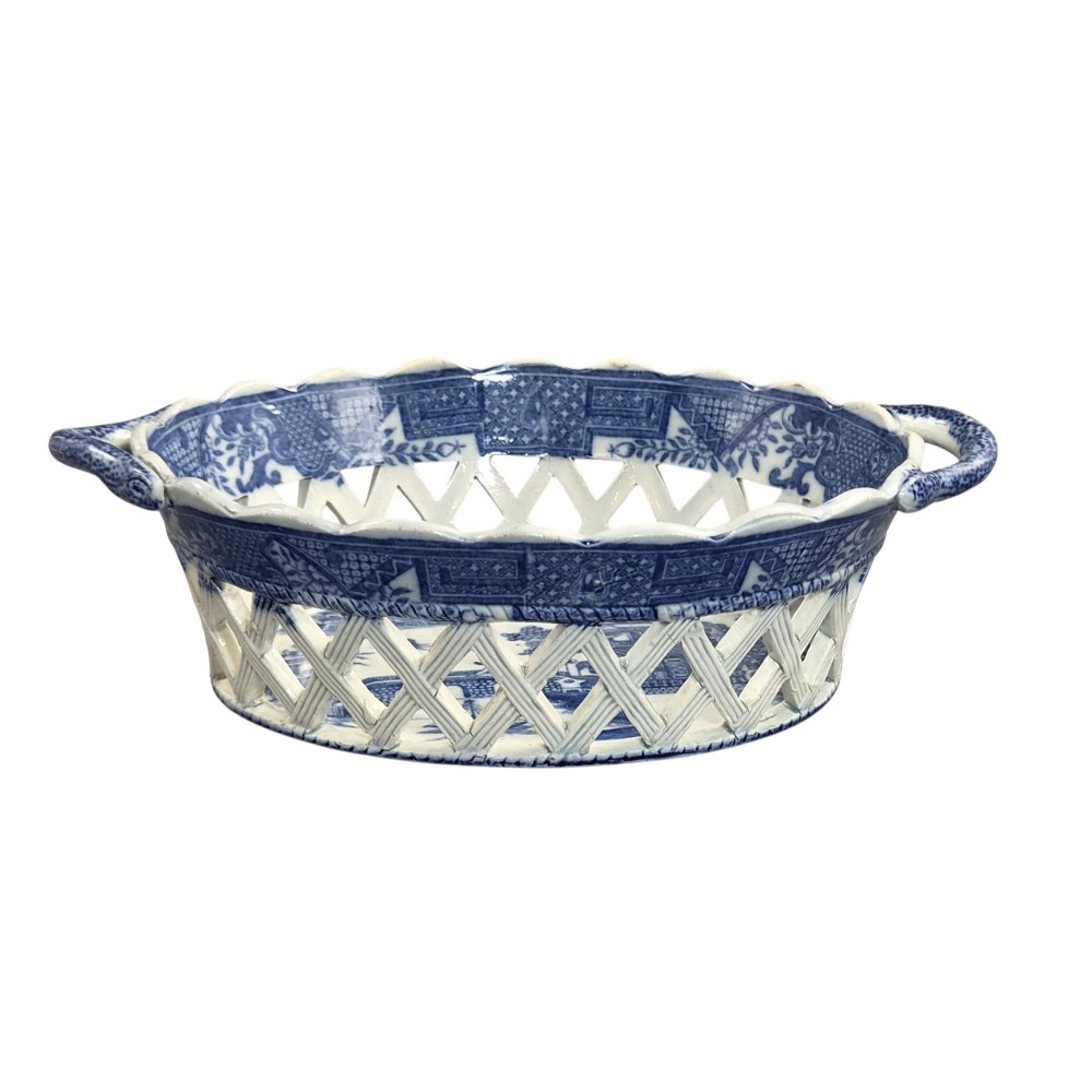 A Regency period blue and white transfer-printed ceramic chestnut basket featuring openwork reticulated lattice sides and two loop side handles. View VI
