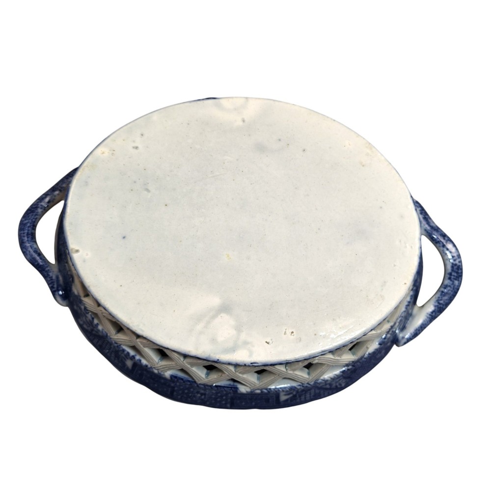 A Regency period blue and white transfer-printed ceramic chestnut basket featuring openwork reticulated lattice sides and two loop side handles. View VIII