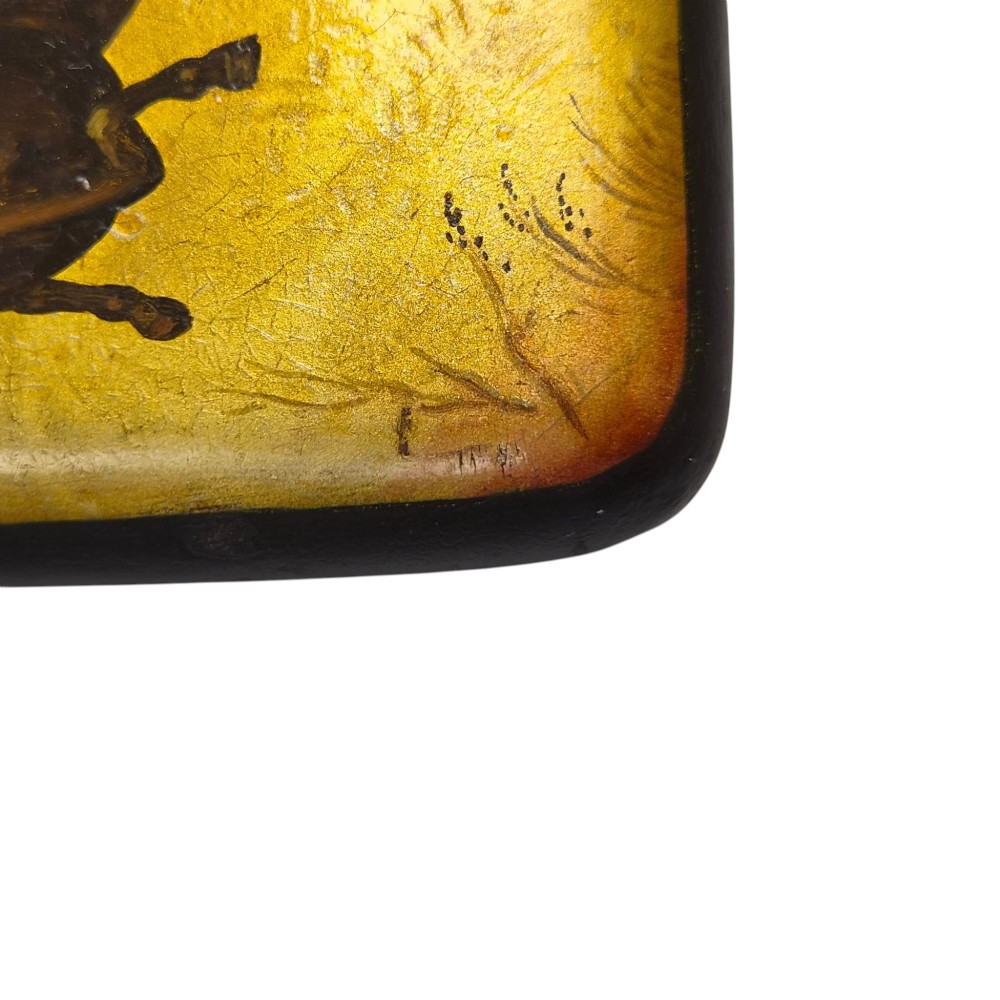 A rectangular 19th-century Russian lacquer cigarette case featuring a hand-painted scene of three horses pulling a sleigh across a snowy landscape on a gold background. View V