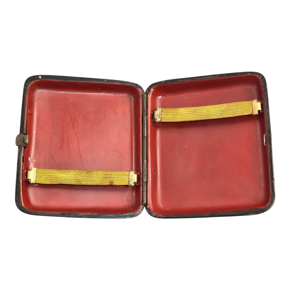 A rectangular 19th-century Russian lacquer cigarette case featuring a hand-painted scene of three horses pulling a sleigh across a snowy landscape on a gold background. View VI