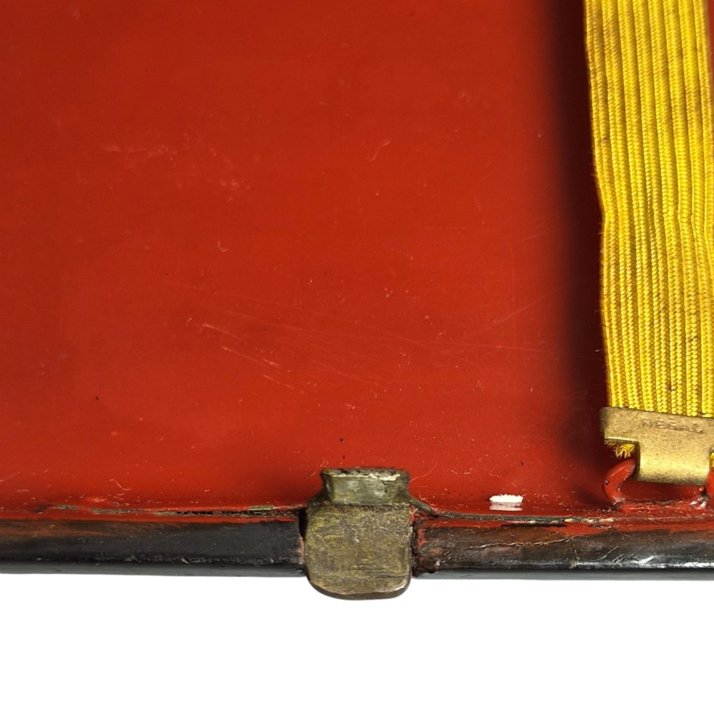 A rectangular 19th-century Russian lacquer cigarette case featuring a hand-painted scene of three horses pulling a sleigh across a snowy landscape on a gold background. View VII