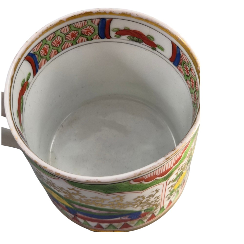A Regency period Worcester porcelain coffee cup and matching saucer decorated in the hand-painted Dragon in Compartments pattern with green, red, blue, and gilt detailing. View XIII