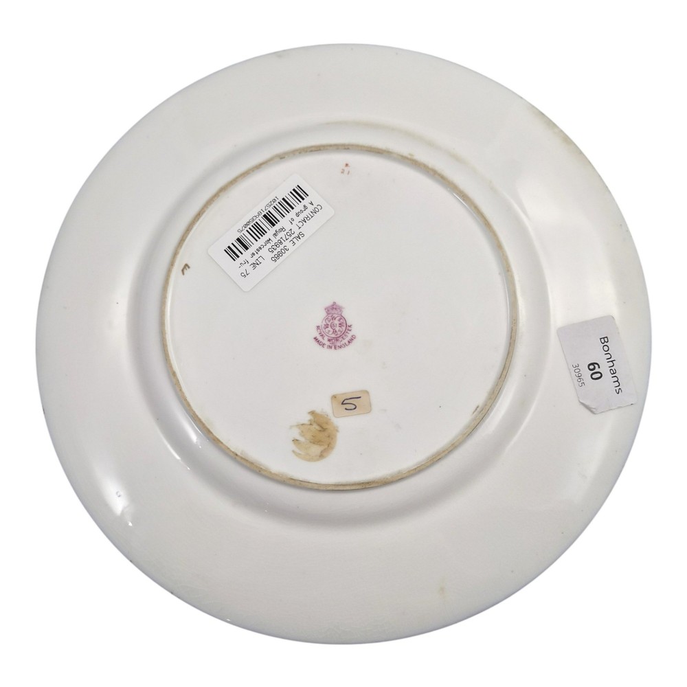 A circular Royal Worcester porcelain cabinet plate featuring a cobalt blue rim with detailed gold gilding framing a central painted still life of apples and berries. View V
