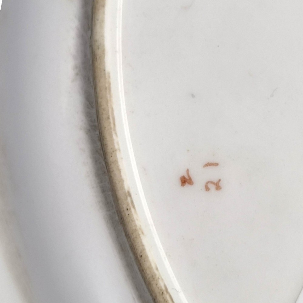 A circular Royal Worcester porcelain cabinet plate featuring a cobalt blue rim with detailed gold gilding framing a central painted still life of apples and berries. View VII