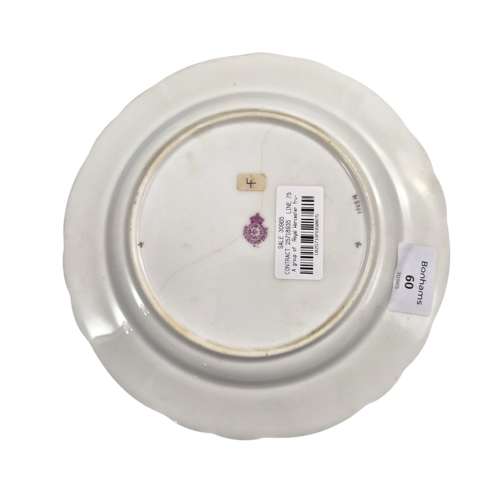 A circular porcelain cabinet plate featuring a central hand-painted fruit still life surrounded by a heavily gilded burgundy rim with scalloped edges. View IV