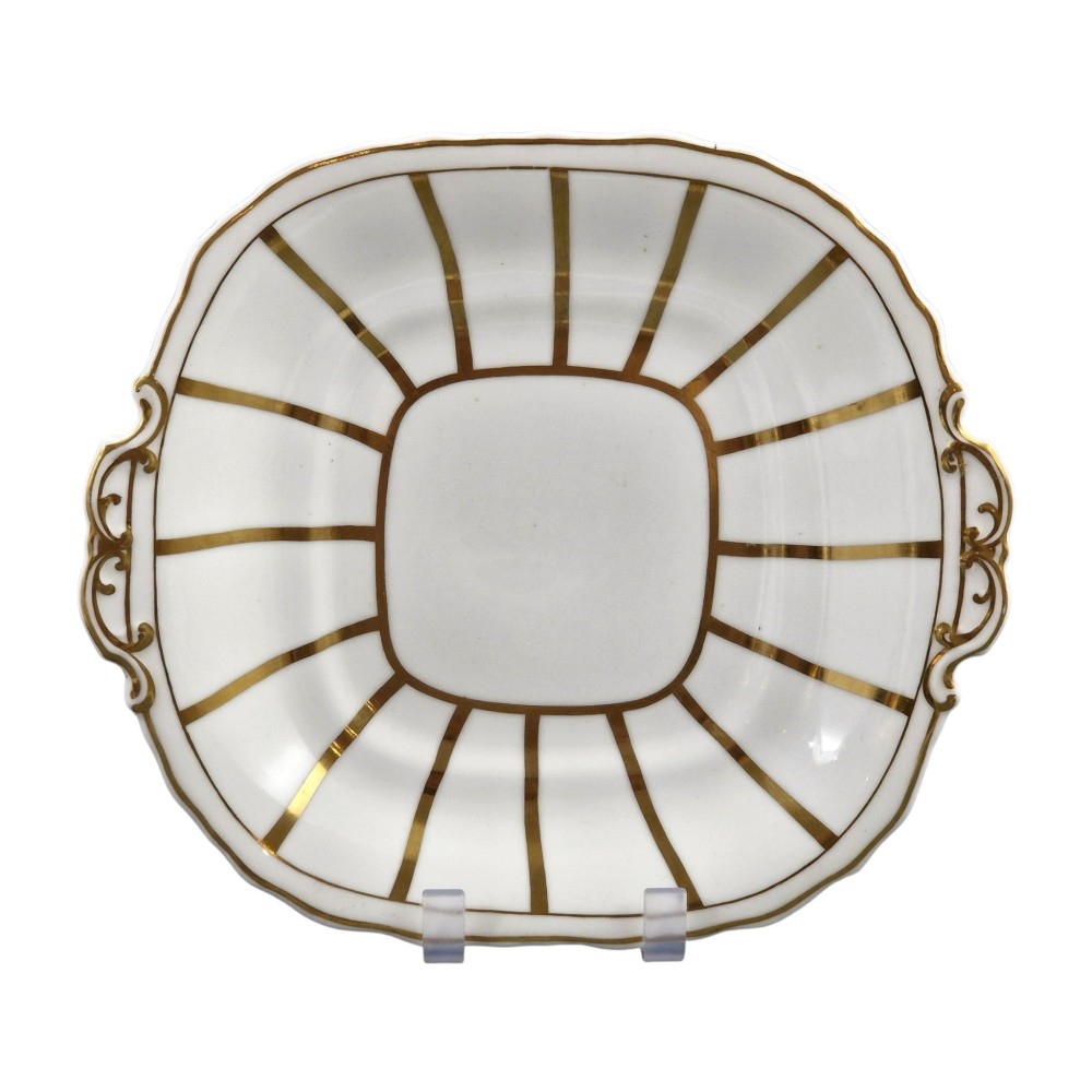 A Victorian Davenport bone china sauce tureen with lid and undertray, decorated with white glaze, gilded radial stripes, and an artichoke finial. View II