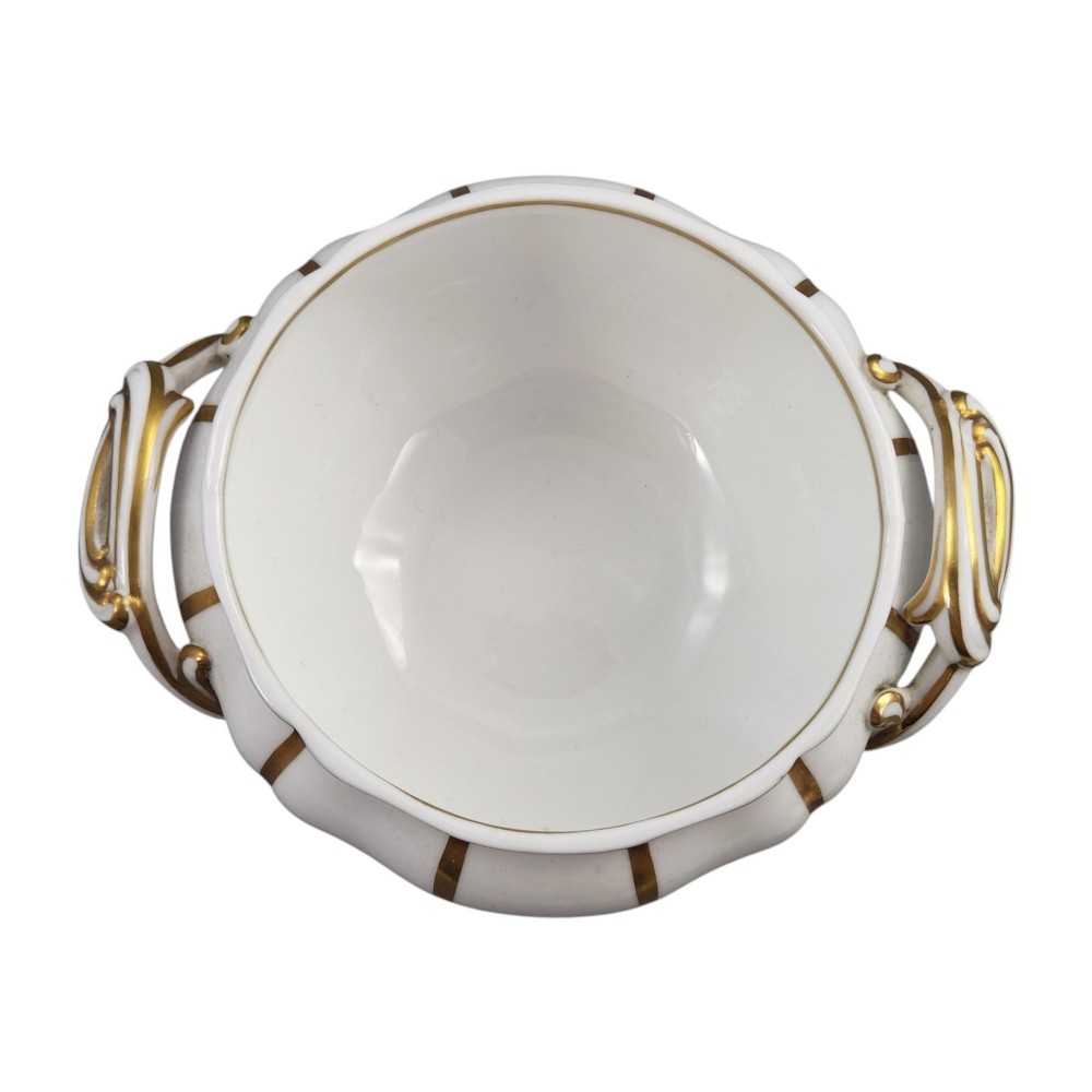 A Victorian Davenport bone china sauce tureen with lid and undertray, decorated with white glaze, gilded radial stripes, and an artichoke finial. View XI