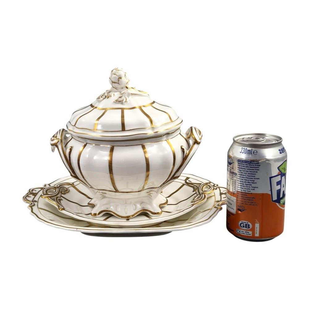 A Victorian Davenport bone china sauce tureen with lid and undertray, decorated with white glaze, gilded radial stripes, and an artichoke finial. View XV