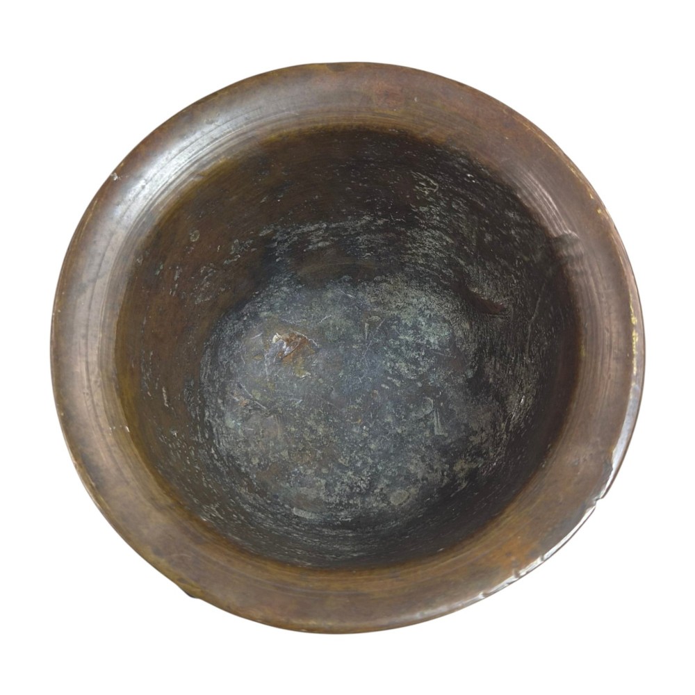 A heavy 17th-century cast bronze apothecary mortar featuring raised heraldic coat of arms motifs and side lugs around a flared rim. View III