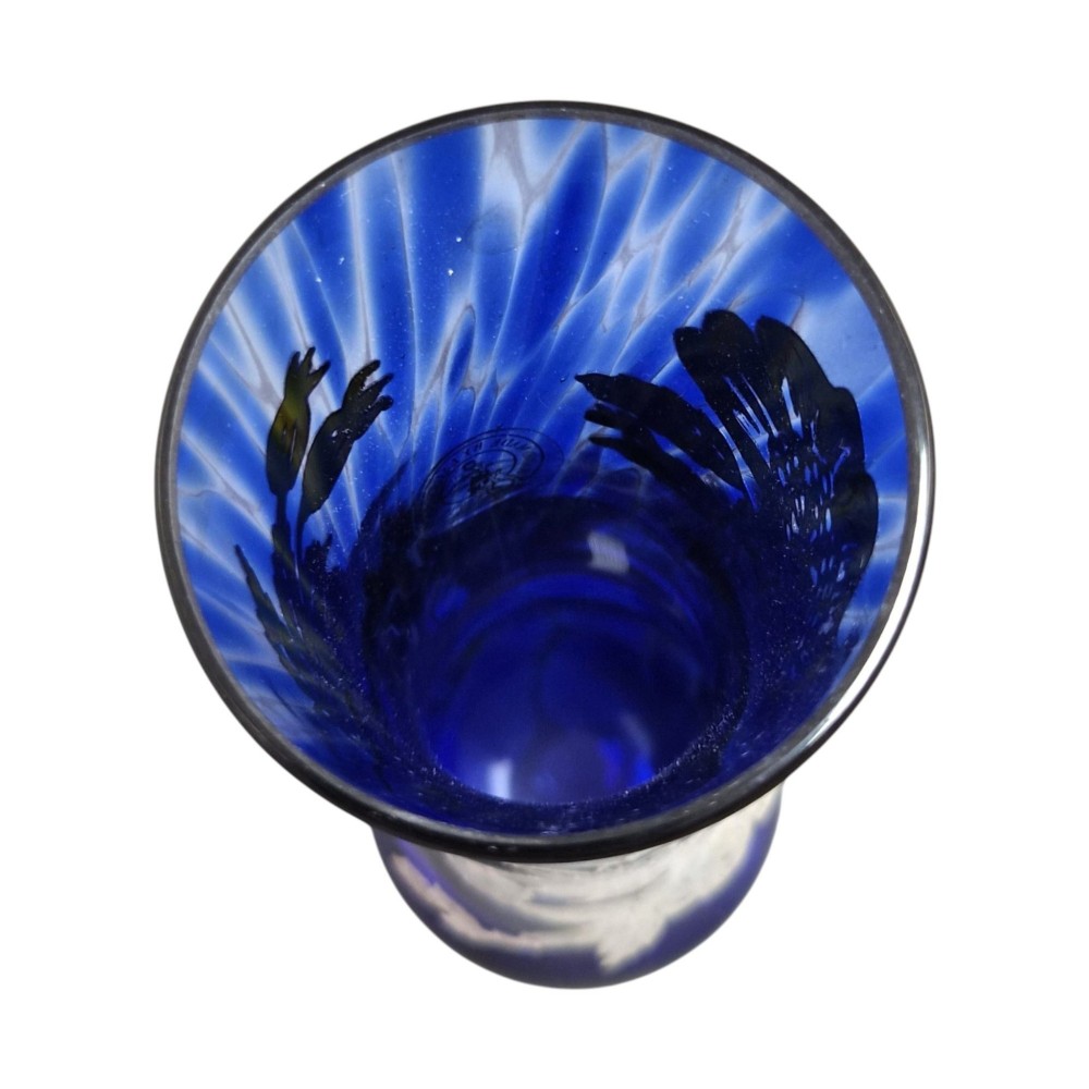 A cobalt blue glass vase and matching perfume bottle with stopper, both featuring intricate sterling silver floral overlay. View VI