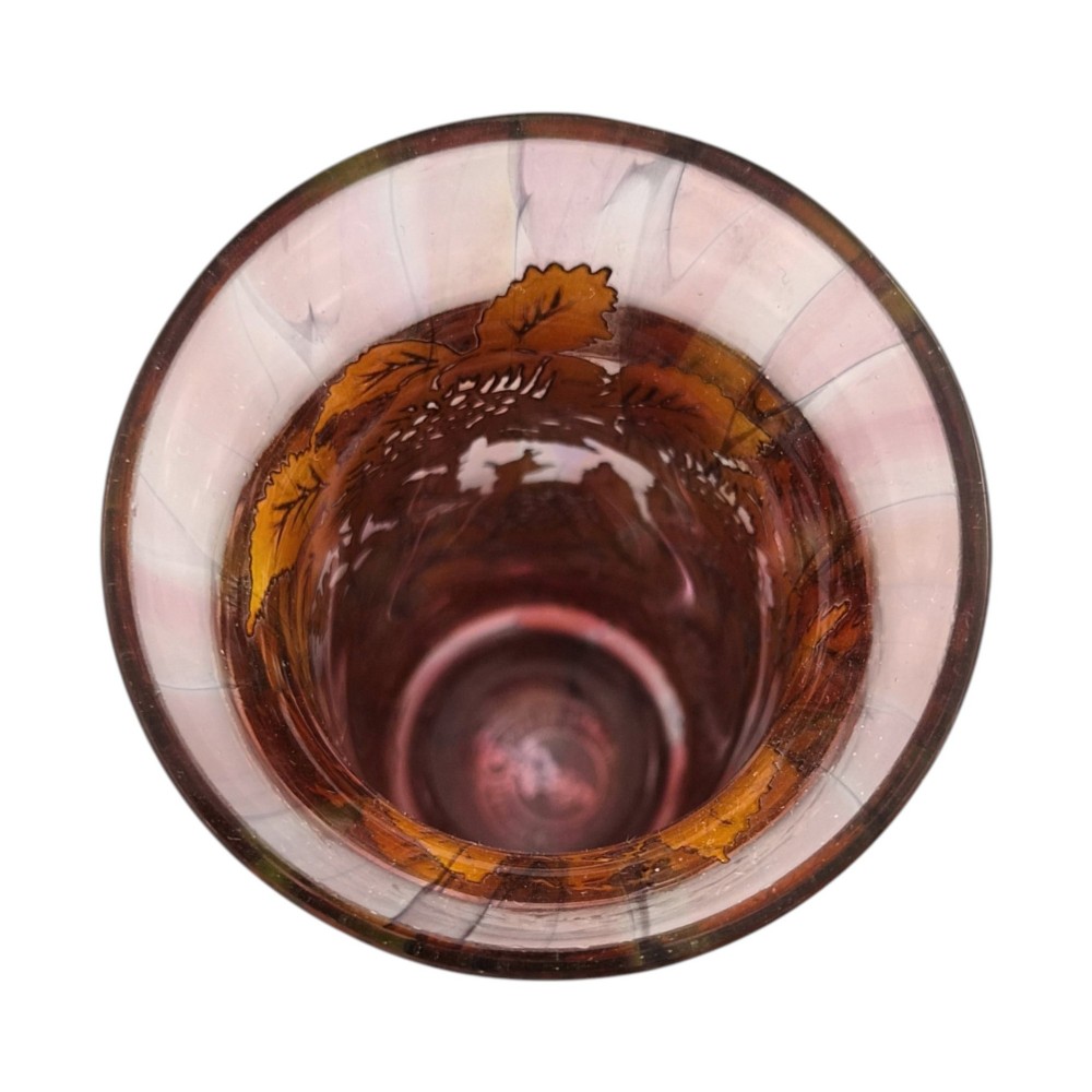 A three-piece ruby red glass vanity set featuring floral sterling silver overlay details across two stoppered bottles and a cylindrical beaker. View VII